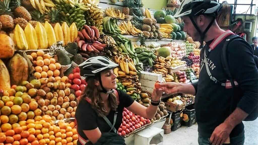 ecuador quito bike tour at local fruit market