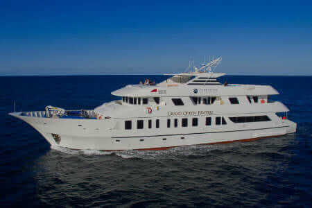 Grand queen beatriz yacht cruising the blue waters at Galapagos islands