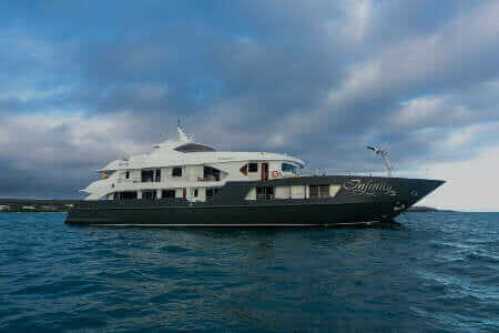 side view of the infinity yacht at the galapagos islands
