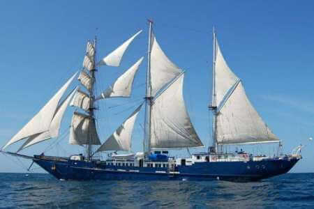 side view of the impressive mary anne yacht cruising at the Galapagos islands