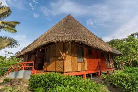 Napo cultural center rustic style thatched bamboo cabin in golden light