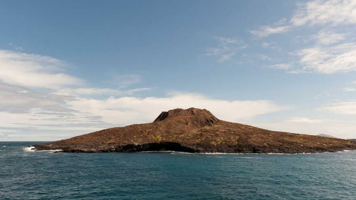 chinese hat galapagos island with blue ocean and skies