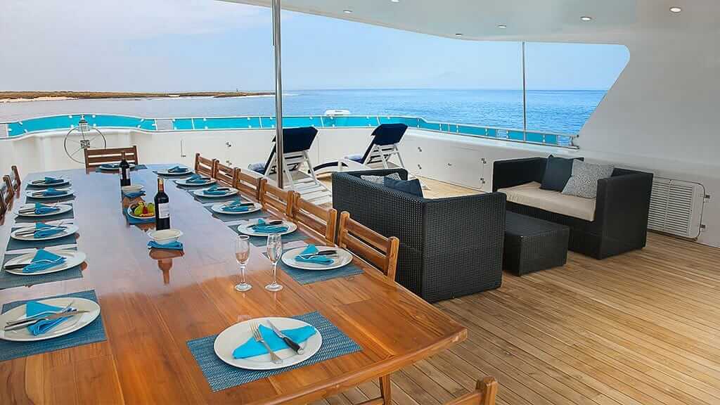 cormorant catamaran yacht galapagos island cruise - al fresco dining area with spectacular ocean views