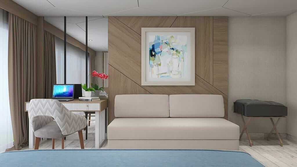 Elite Yacht Galapagos Cruise - Gästekabine mit Sofa und Schreibtisch
