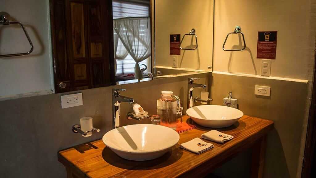 NWC Napo Wildlife Center ecolodge ecuador - bathroom twin wash basins and mirror in guest cabin