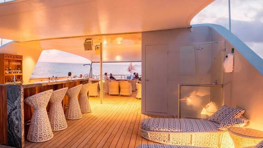 Theory Galapagos yacht - outdoor social lounge and bar