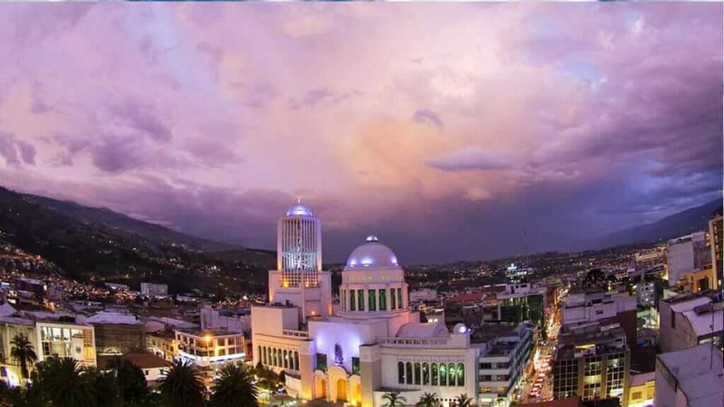 best cities in ecuador - ambato cityscape illuminated at night
