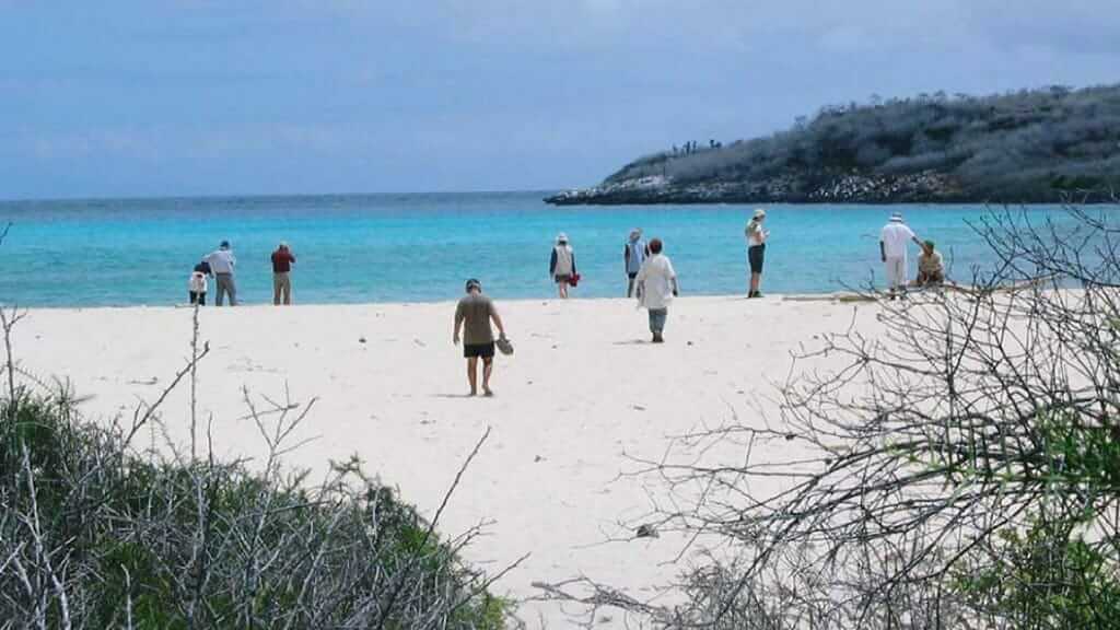 visitors at ochoa beach san cristobal galapagos