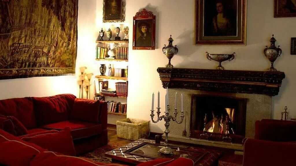 open fireplace, cosy sofa and wall hanging at hotel casa san marcos in quito