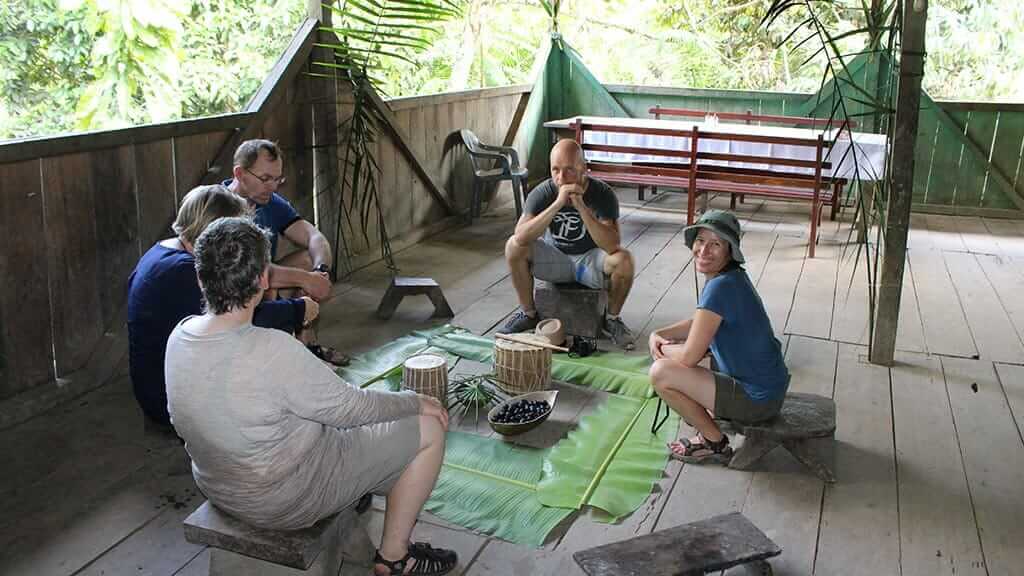 tourists learning about amazon musical instruments