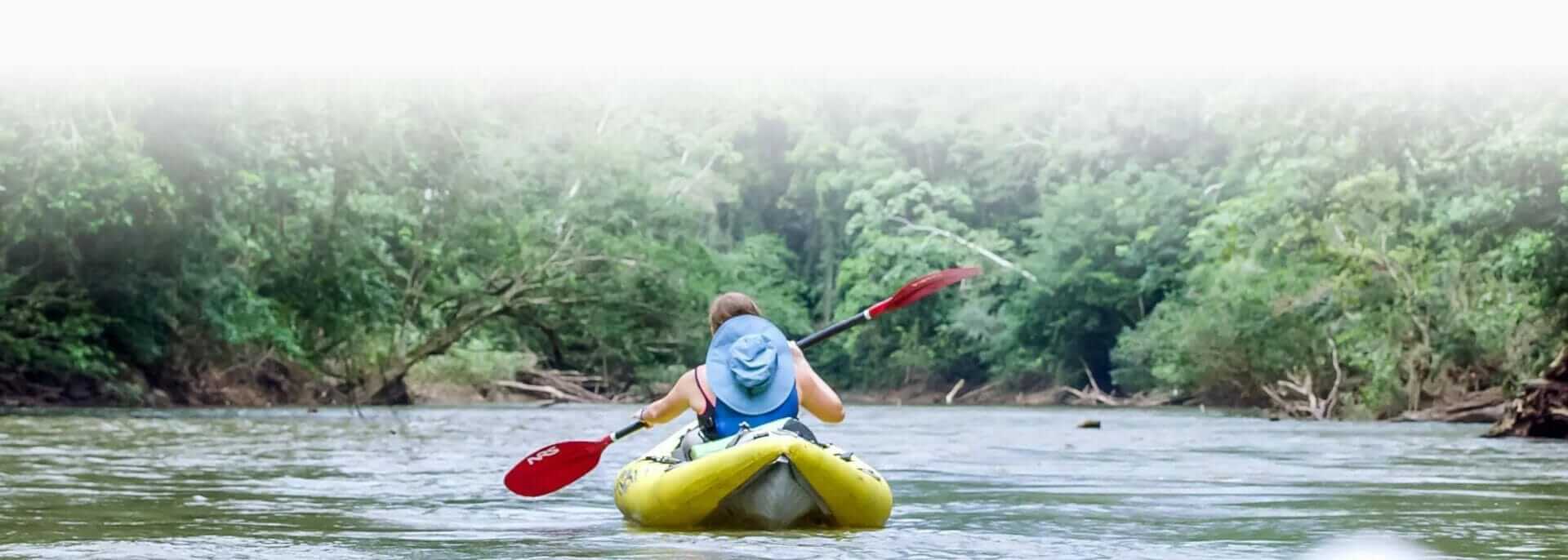 kayaker in ecuador amazon jungle