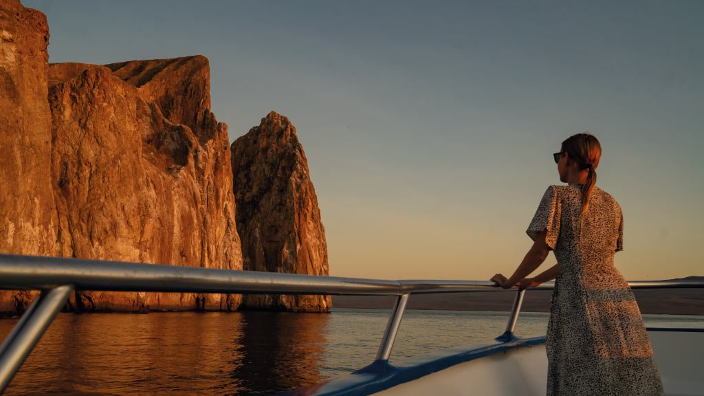 Passenger-in-the-exterior-lounge-watching-the-galapagos sunset