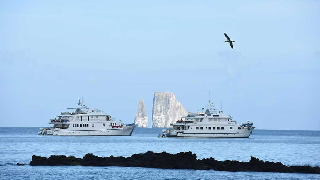 two galapagos cruise yacht in front of kicker rock san cristobal