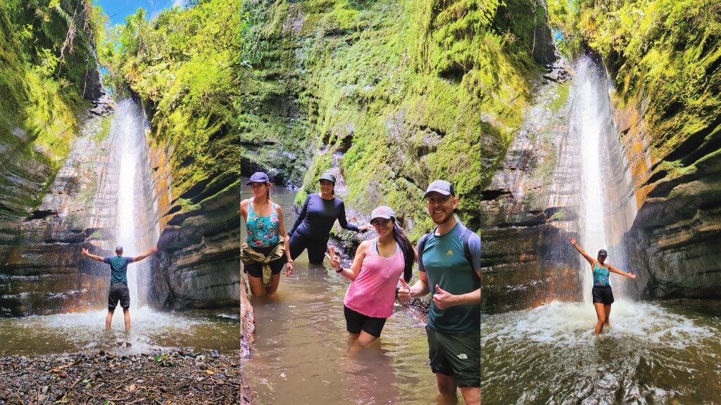 ecuador waterfalls - tourists enjoying the hidden waterfall (casacada escondida)