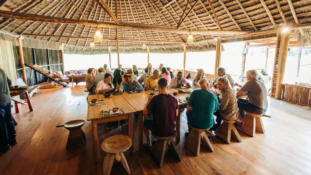 tourist group dining at kapawi ecolodge restaurant
