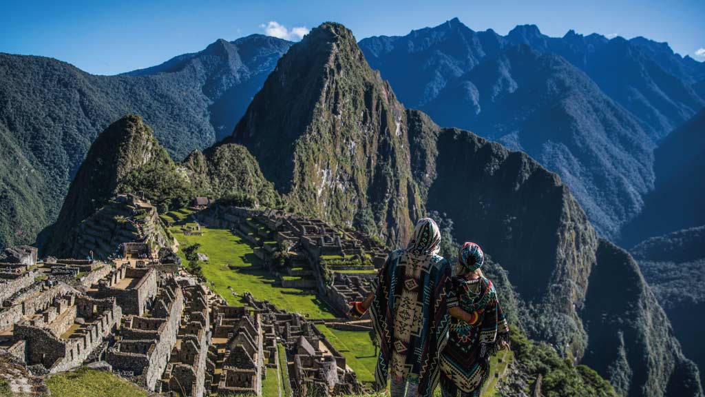 machu-picchu-couple at ruins in ponchos