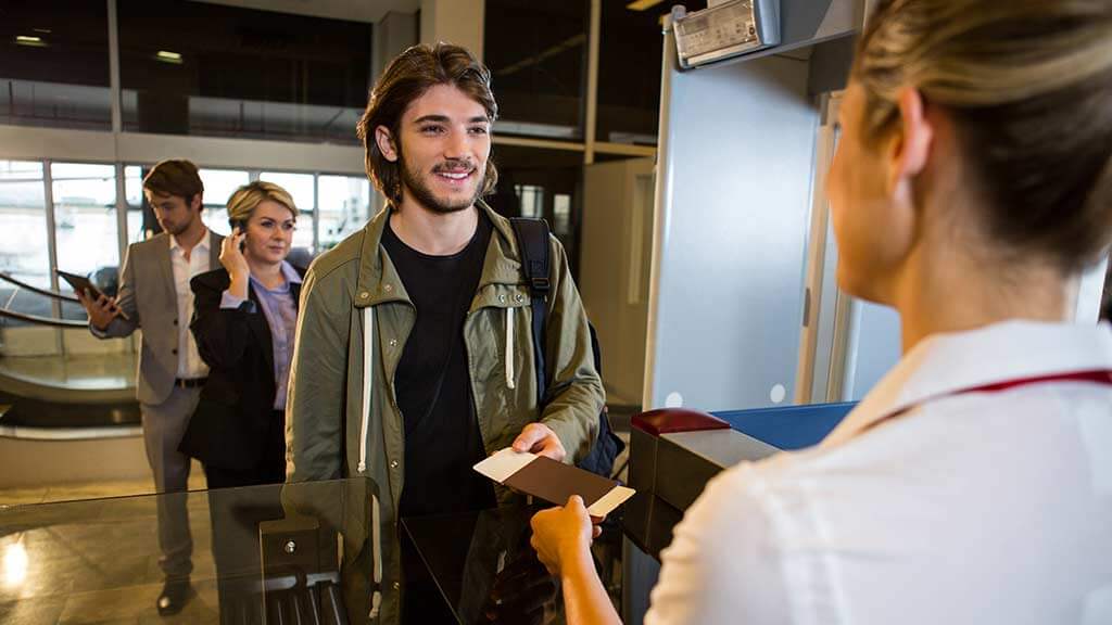 ecuador entry requirements - A man presenting his passport to enter Ecuador