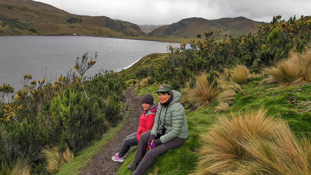 tourists trek at laguna micacocha antisana reserve ecuador