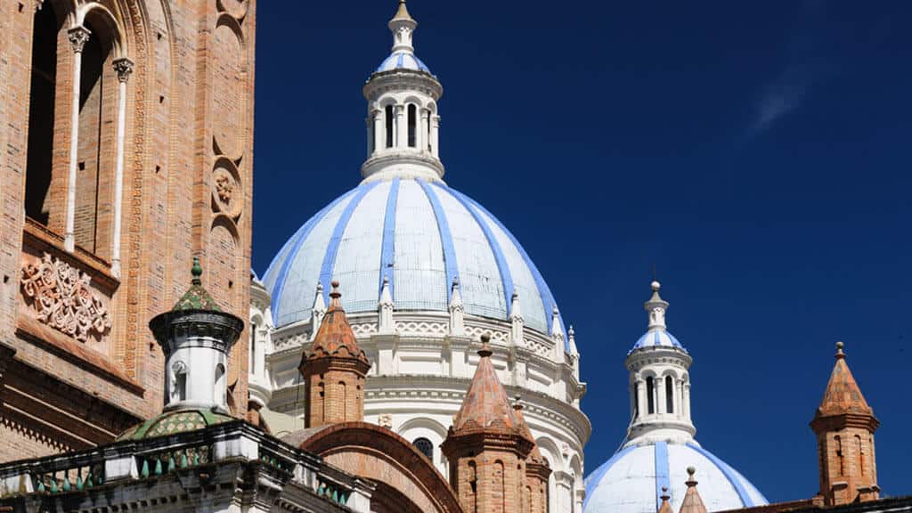 blue spires of cuenca cathedral ecuador