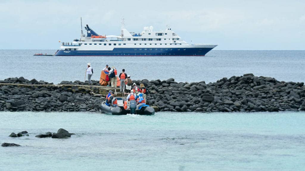 celebrity xpedition cruise ship at espanola island galapagos