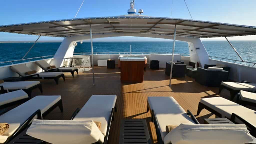 galapagos islands celebrity xploration catamaran sun deck loungers with view