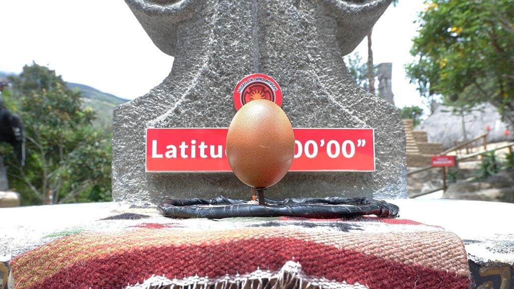 balance egg on nail equator tour quito