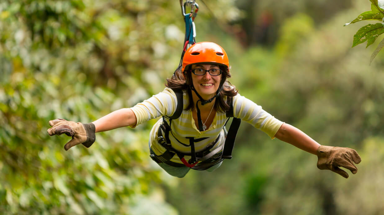 tourists enjoying ecuador canopy ziplining